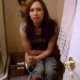 Four guys watch a cute girl pooping on the toilet. You can clearly hear the plop. She wipes her ass and has trouble flushing the toilet - resulting in laughter from the group. This is a previously posted clip remastered for better quality.